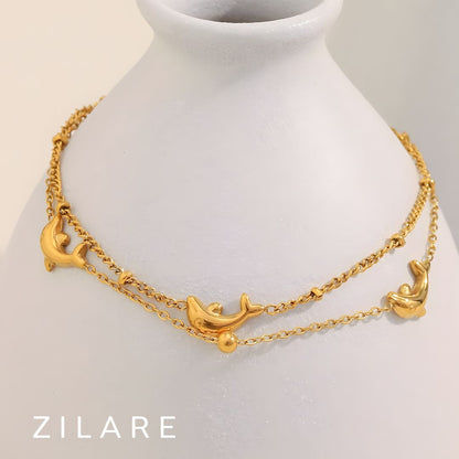 Pulsera dorada doble con delfines baño de oro 18k Paloma