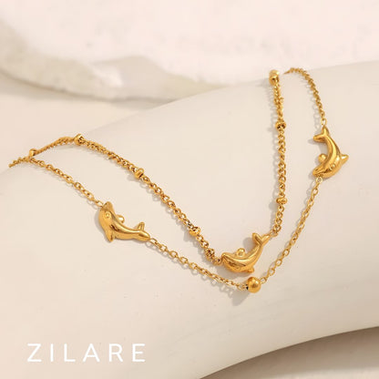 Pulsera dorada doble con delfines baño de oro 18k Paloma