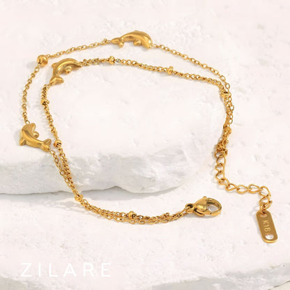 Pulsera dorada doble con delfines baño de oro 18k Paloma
