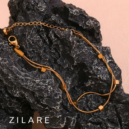 Pulsera dorada doble elegante con baño de oro 18k Leira