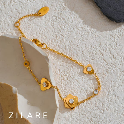 Pulsera dorada con flor y brillo bañado en oro 18k Eliana