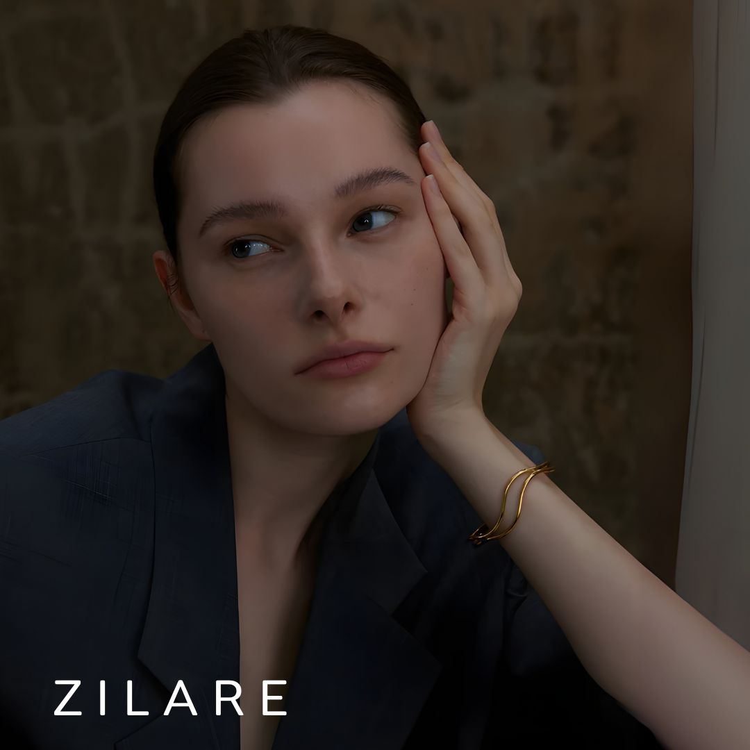 Pulsera dorada líneas dobles curvas bañada en oro 18k Diana