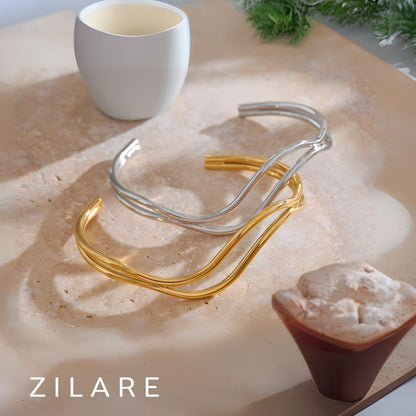 Pulsera dorada líneas dobles curvas bañada en oro 18k Diana