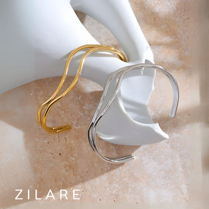 Pulsera dorada líneas dobles curvas bañada en oro 18k Diana