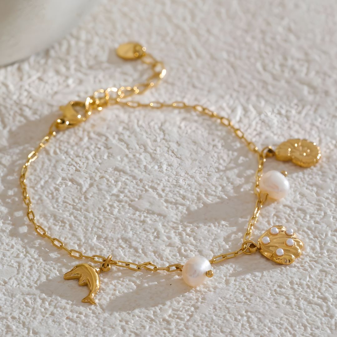 Pulsera dorada marina con dijes bañada en oro 18k Isadora